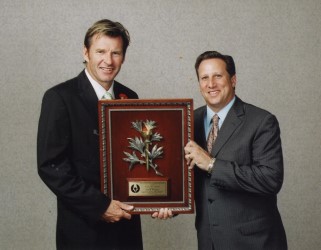 2005 Gold Tee winner Nick Faldo receives his award from former MGWA President Bruce Beck