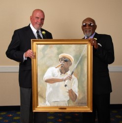 Charlie Sifford receives his portrait from Paul&nbsp;Dillon