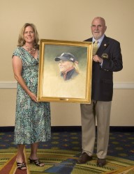 Artist Paul Dillon presents Betsy&nbsp;King with her portrait