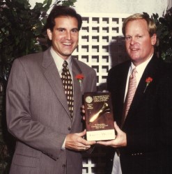 Johnny Miller accepts the 1996 Gold Tee Award from MGWA member Jim Nantz